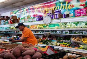 A man shops for produce at Best World Supermarket in the Mount Pleasant neighborhood of Washington, D.C., U.S., August 19, 2022.