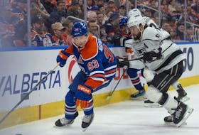 Ryan Nugent-Hopkins (93) of the Edmonton Oilers, skates away from Drew Doughty(8) of the Los Angeles Kings at Rogers Place in Edmonton on Feb. 26, 2024.