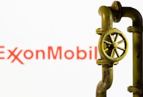 A 3D printed natural gas pipeline is placed in front of displayed ExxonMobil logo in this illustration taken February 8, 2022.