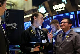 Traders work on the floor at the New York Stock Exchange (NYSE) in New York City, U.S., February 29, 2024. 