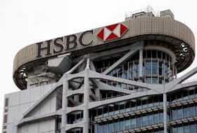 The logo of HSBC is seen on its headquarters in the financial Central district in Hong Kong, China, Aug. 4, 2020.