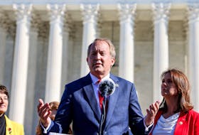 Texas Attorney General Ken Paxton speaks to anti-abortion supporters outside the U.S. Supreme Court following arguments over a challenge to a Texas law that bans abortion after six weeks in Washington, U.S., November 1, 2021.