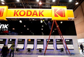 A worker cleans a Kodak booth at the Las Vegas Convention Center in preparation for 2019 CES in Las Vegas, Nevada, U.S. January 6, 2019.