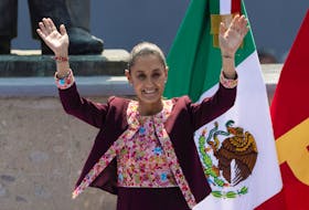 Claudia Sheinbaum of Mexico's ruling National Regeneration Movement (MORENA) party waves during an event with supporters on the day she registers as a presidential candidate for the upcoming June 2 general election at the National Electoral Institute (INE), in Mexico City, Mexico February 18, 2024.