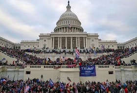 A mob of supporters of U.S. President Donald Trump storm the U.S. Capitol Building in Washington, U.S., January 6, 2021.
