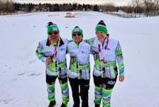 Two Team P.E.I. athletes, coached by Kathleen MacNearney, centre, each won two medals in cross-country skiing events at the 2024 Special Olympics Canada Winter Games in Calgary on Feb. 28 and 29. Ellen MacNearney, right, won gold in the five-kilometre race and silver in the 7.5-kilometre event. Tommy Ling, left, won silver medals in the 100- and 500-metre events. Special Olympics P.E.I. • Special to The Guardian