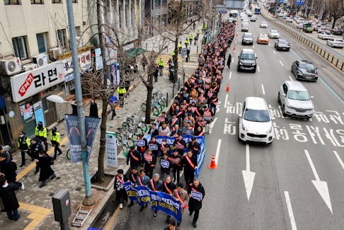 South Korean doctors march to the Presidential Office to protest against the government's medical policy in Seoul, South Korea, February 25, 2024.