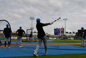 Mar 1, 2024; Clearwater, Florida, USA; Miami Marlins right fielder Jesus Sanchez (12) prepares for batting practice  before the start of the spring training game against the Philadelphia Phillies at BayCare Ballpark. Mandatory Credit: Jonathan Dyer-USA TODAY Sports