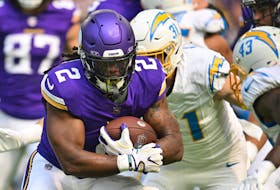 Sep 24, 2023; Minneapolis, Minnesota, USA; Minnesota Vikings running back Alexander Mattison (2) runs the ball as Los Angeles Chargers linebacker Nick Niemann (31) moves in for the tackle during the first quarter at U.S. Bank Stadium. Mandatory Credit: Jeffrey Becker-USA TODAY Sports/ File Photo