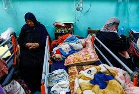 A Palestinian child lies on a bed at Abu Yousef al-Najjar hospital, while Gaza residents face crisis levels of hunger and soaring malnutrition, in Rafah in the southern Gaza Strip January 24, 2024.