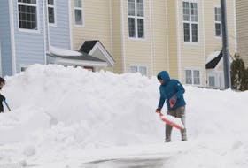These two residents of Beothuck Street in St. John's tackle the snow clearing by their home on Saturday afternoon, March 9, 2024 a few hours after the winter storm was over, leaving upwards of 70 centimetres of fresh snow behind.
-Photo by Joe Gibbons/The Telegram