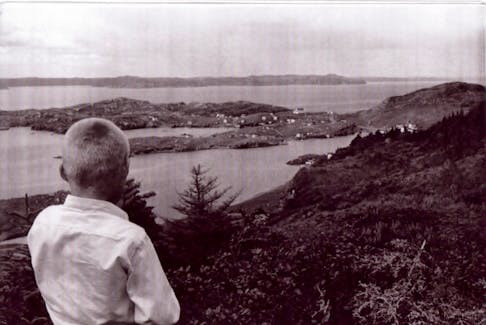 A young Basil Rose looks out over Long Point Hill. - Merasheen.org