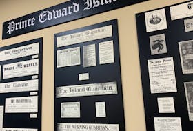 A wall in The Guardian office in Charlottetown features a wall of flags and mastheads from newspapers published throughout Prince Edward Island's history. Jocelyne Lloyd • SaltWire