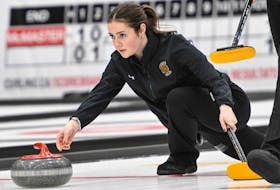 Dalhousie skip Allyson MacNutt delivers a shot during the U Sports curling championships in Fredericton. The Tigers defeated the UNB Reds 9-2 in the women’s bronze medal game on Sunday. - U SPORTS