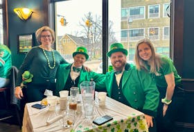 The Langille family, from Nova Scotia, followed the Confederation Bridge rather than a rainbow to their destination for Saint Patrick's Day in Charlottetown on March 17. The family, from left, Darlene, David, Shane and Emily Langille, gathered for their annual tradition at The Old Triangle Irish Alehouse in the P.E.I. capital. For more Saint Patrick's Day photos, see A4.
 Thinh Nguyen • The Guardian