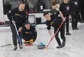 The St. John’s Curling Club (RE/MAX Centre) are hosting the 2024 Canadian Pride Curling Championship (competitive) & The Big Jib Draw (fun spiel) this week. The event began on Thursday morning, March 14, 2024, and concludes on Sunday, March 17th., with the finale beginning at 3 p.m. on St. Patrick’s Day afternoon. The St. John’s “Odds & Ends” foursome skipped by Jeremy Grimes, took on Toronto, Ontario’s Bill Francis “Mansperlaw” foursome in their competitive opening afternoon Draw 3 at 3 p.m. Above, lead Justin Garrett, left, and second Scott Lester, right, take a shot by third Ryan Davis, centre, down the ice in first-end action.
-Photo by Joe Gibbons/The Telegram