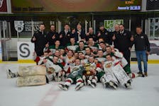 The Kensington Monaghan Farms Wild poses for a team photo on the ice at MacLauchlan Arena in Charlottetown after winning the P.E.I. major under-18 male hockey championship on March 17. The Wild defeated the Charlottetown Bulk Carriers Knights 6-2 to sweep the best-of-seven series. Jason Simmonds • The Guardian