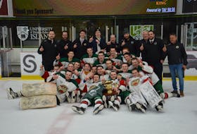 The Kensington Monaghan Farms Wild poses for a team photo on the ice at MacLauchlan Arena in Charlottetown after winning the P.E.I. major under-18 male hockey championship on March 17. The Wild defeated the Charlottetown Bulk Carriers Knights 6-2 to sweep the best-of-seven series. Jason Simmonds • The Guardian