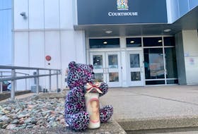 This teddy bear and candle were placed on the steps leading to the courthouse in Sydney on Monday as the Supreme Court retrial of the man accused in Talia Forrest's  hit-and-run death continues. A family member told the post that the teddy bear was made from a pair of the 10-year-old’s pyjamas. Cape Breton Post