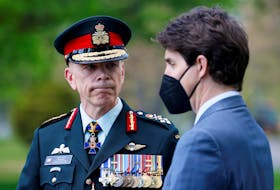 FILE PHOTO: Canada's Chief of the Defence Staff, General Wayne Eyre looks at Prime Minister Justin Trudeau during a ceremony at the National Military Cemetery in Ottawa, Ontario, Canada May 13, 2022. REUTERS/Blair Gable  Canada's Chief of the Defence Staff, Gen. Wayne Eyre, attends a ceremony  with Prime Minister Justin Trudeau at the National Military Cemetery in Ottawa on May 13, 2022.