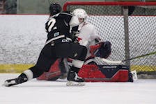 Bage Valley Wildcats goalie Aaron Meaden stops WearWell Bombers captain Evan MacIntosh during under-15 hockey March 17 at the Kings Mutual Century Centre in Berwick.  
- Jason Malloy