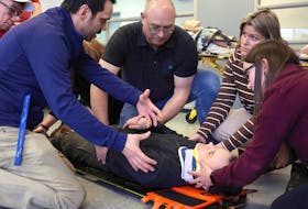 Instructor Mike Miller teaches students how to secure a patient to a spine board. Emergency medical response students started their studies on March 4 in Dartmouth. They will learn how to give basic life support, first aid, patient assessments and how to secure a safe scene. COMMUNICATIONS NOVA SCOTIA