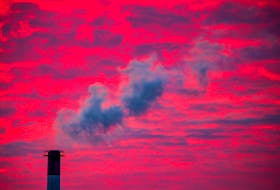 Steam rises from a smoke stack at sunset in Lansing, Michigan, U.S., January 17, 2018.