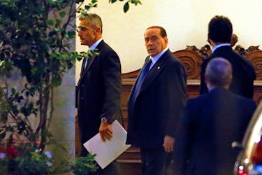 Italy's former Prime Minister Silvio Berlusconi (C) leaves his residence at Grazioli palace, downtown Rome June 25, 2013.