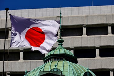 The Japanese national flag waves at the Bank of Japan building in Tokyo, Japan March 18, 2024.