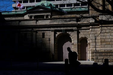 A man walks past the Bank of Japan building in Tokyo, Japan March 18, 2024.