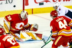 Calgary Flames goalie Dustin Wolf is scored on by Washington Capitals Alex Ovechkin in second period NHL action at the Scotiabank Saddledome in Calgary on Monday, March 18, 2024. Darren Makowichuk/Postmedia