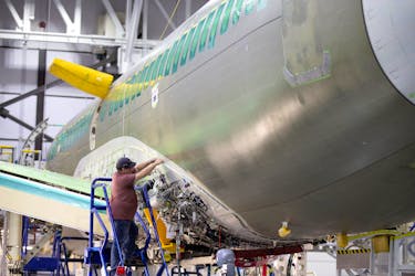 An employee works on an Airbus A220-300 at the Airbus facility in Mirabel, Quebec, Canada February 20, 2020. 