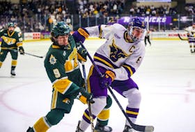 College standout Sam Morton, right, has signed a contract with the Calgary Flames for the 2024-25 campaign. (Photo by Kenzie Schmidt, courtesy of Minnesota State Mavericks)