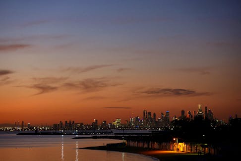 A view of Brighton Beach in front of the Melbourne skyline during sunset in Melbourne, Australia, July 19, 2023.  
