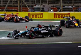 Formula One F1 - Bahrain Grand Prix - Bahrain International Circuit, Sakhir, Bahrain - March 2, 2024 Mercedes' George Russell and Red Bull's Sergio Perez in action during the race