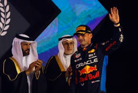 Formula One F1 - Bahrain Grand Prix - Bahrain International Circuit, Sakhir, Bahrain - March 2, 2024 Red Bull's Max Verstappen celebrates on the podium after winning the Bahrain Grand Prix