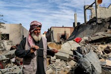 A Palestinian stands at the site of an Israeli strike on a house, amid the ongoing conflict between Israel and Hamas, in Rafah in the southern Gaza Strip, March 1, 2024.