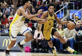 Raptors' Scottie Barnes, right, dribbles against Trayce Jackson-Davis of the Warriors during first half NBA action at Scotiabank Arena in Toronto, Friday, March 1, 2024.