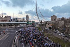 A drone photo shows families and supporters of hostages kidnapped in the deadly October 7 attack on Israel by the Palestinian Islamist group Hamas, as they take part in the four-day march from Reim to Jerusalem as they call for the release of hostages, while entering Jerusalem, Israel, March 2, 2024.