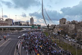 A drone photo shows families and supporters of hostages kidnapped in the deadly October 7 attack on Israel by the Palestinian Islamist group Hamas, as they take part in the four-day march from Reim to Jerusalem as they call for the release of hostages, while entering Jerusalem, Israel, March 2, 2024.