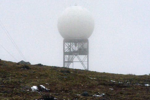 Weather station whiteout  
   
The Holyrood radar station sits shrouded in fog and drizzle Monday morning. Keith Gosse • The Telegram