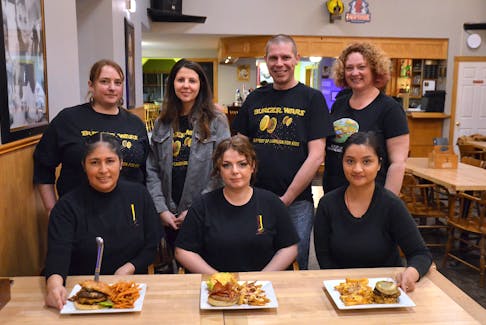 Some of the members of Team Burger Wars were on hand to help choose this year’s burger entry for the Burger Wars campaign recently at the Capitol Pub in Middleton. Front row, from left, are chefs Geovanna Vicens, Holly Hall and Sushmita Tuladhar. Second row, Team Burger Wars members Danielle West, Brannigan Bowlby, Josh West and Laura Churchill Duke.  
- Lawrence Powell • Special to the Annapolis Valley Register