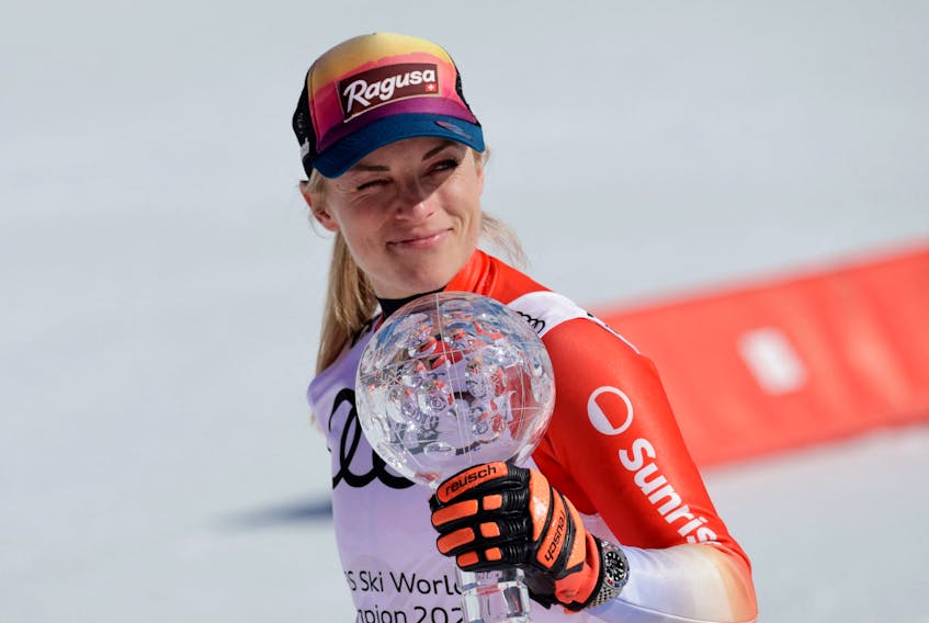 Alpine Skiing - FIS Alpine Ski World Cup - Women's Super G - Saalbach, Austria - March 22, 2024 Switzerland's Lara Gut-Behrami celebrates with the crystal globe after winning the Super G world cup