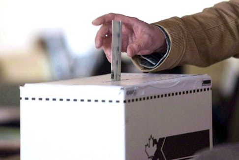 A voter casts a ballot in the 2011 federal election. 