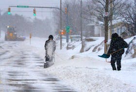 Methods of removal  
   
Two residents on Canada Drive try to keep ahead of the snow during Friday’s storm that dumped huge amounts of snow and ice pellets on the eastern part of the province. Keith Gosse • The Telegram