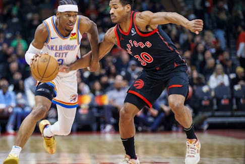 Shai Gilgeous-Alexander #2 of the Oklahoma City Thunder drives against Ochai Agbaji #30 of the Toronto Raptors in the first half of their NBA game at Scotiabank Arena on March 22, 2024 in Toronto.