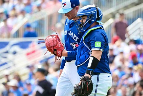 Alejandro Kirk (right) meets with Chris Bassitt of the Toronto Blue Jays in the mound in the third inning against the New York Yankees during a 2024 Grapefruit League Spring Training game at TD Ballpark on March 8, 2024 in Dunedin, Fla.