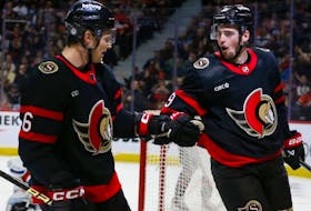 Drake Batherson of the Ottawa Senators (right) celebrates his second-period goal against the Edmonton Oilers with Jakob Chychrun at Canadian Tire Centre on March 24, 2024.