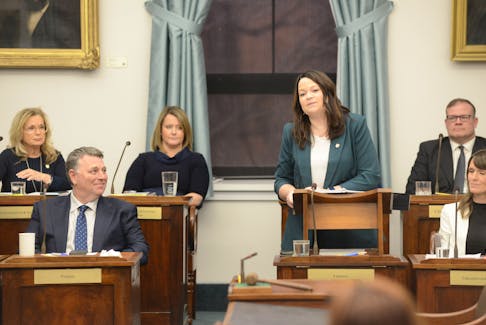 P.E.I. Finance Minister Jill Burridge presents the government's 2024-25 operating budget on Feb. 29, 2024. Listening to the presentation is Premier Dennis King, left.