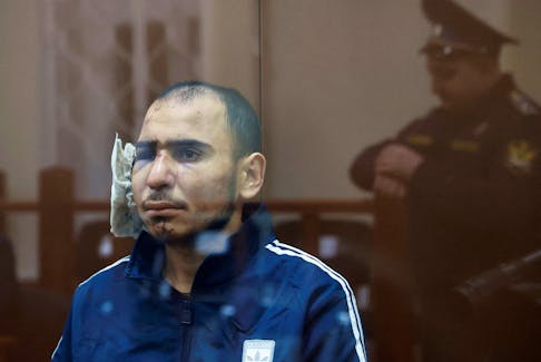 Saidakrami Murodali Rachabalizoda, a suspect in the shooting attack at the Crocus City Hall concert venue, sits behind a glass wall of an enclosure for defendants at the Basmanny district court in Moscow, Russia March 24, 2024.